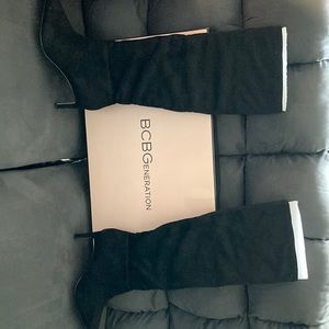 Awesome Designer Boots. Nice size heel and black in color. Never worn.